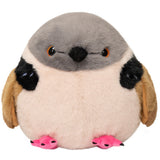A plush penguin toy with a gray head, cream belly, black wing patches, tan wings, and bright pink feet, photographed on a plain white background.